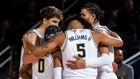Men's Basketball Team Huddle