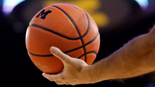 Men's Basketball Holding the Ball