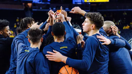 Men's Basketball Team Huddle