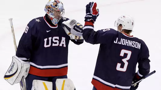Jack Johnson (3) congratulates Ryan Miller (AP Photo)