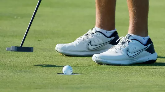 Men's Golf Draining a Putt