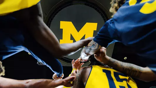 Men's Basketball Team Huddle