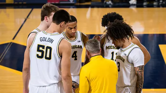Men's Basketball Team Huddle