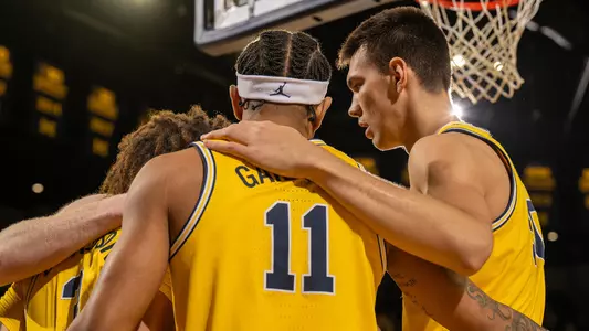 Men's Basketball Group Huddle