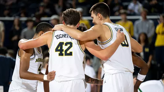 Men's Basketball Group Huddle