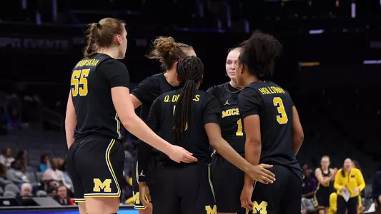 Women's basketball team huddle