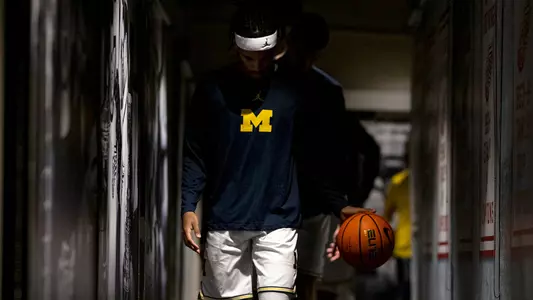 Men's Basketball Dribbling in Tunnel