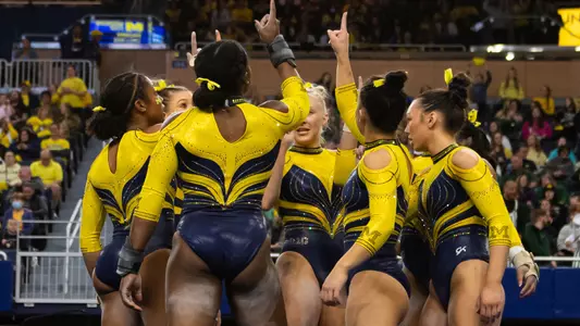 Women's gymnastics team huddle