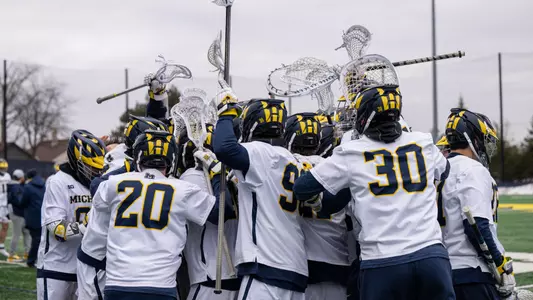 Men's lacrosse team huddle