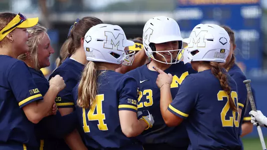 Softball team huddle celebration