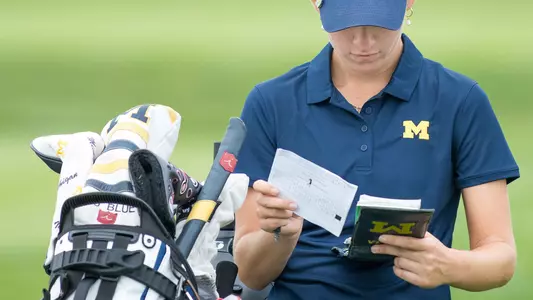 Women's Golf Checking Scorecard