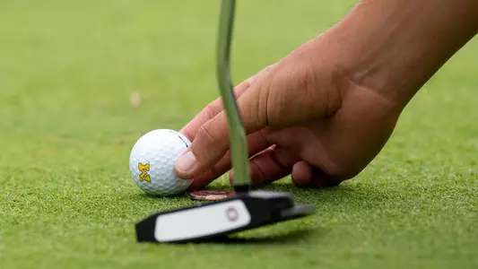 Men's Golf Marking a Ball