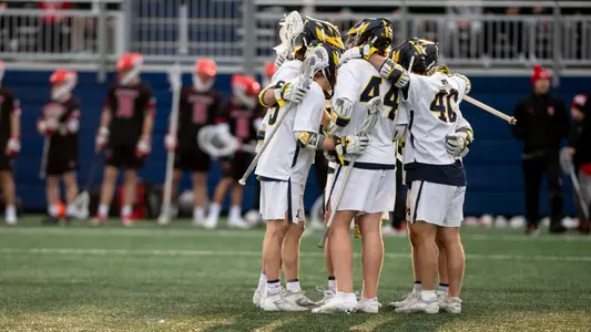 Men's lacrosse team huddle