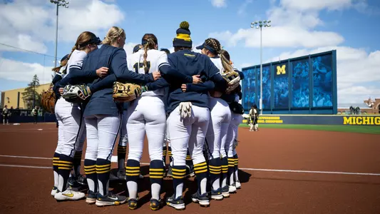 Softball team huddle home
