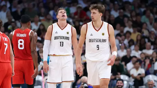 LILLE, FRANCE - JULY 27: Moritz Wagner #13 of Team Germany and Franz Wagner #9 of Team Germany react during the Men's Group Phase - Group A match between Australia and Spain on day one of the Olympic Games Paris 2024 at Pierre Mauroy Stadium on July 27, 2024 in Lille, France. (Photo by Gregory Shamus/Getty Images)