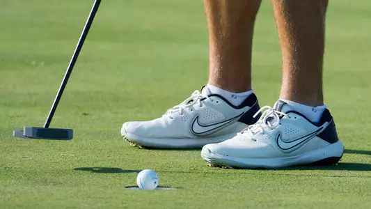 Men's Golf Sinking a Putt
