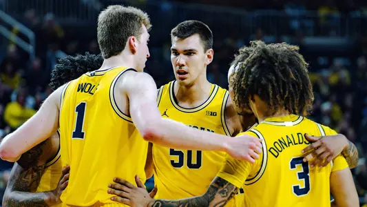 Men's Basketball Group Huddle