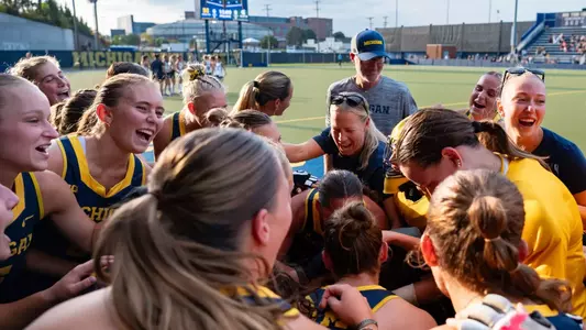 Field hockey team huddle celebration