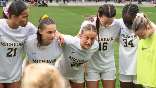 Women's Soccer Group Huddle