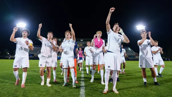 Men's soccer celebration