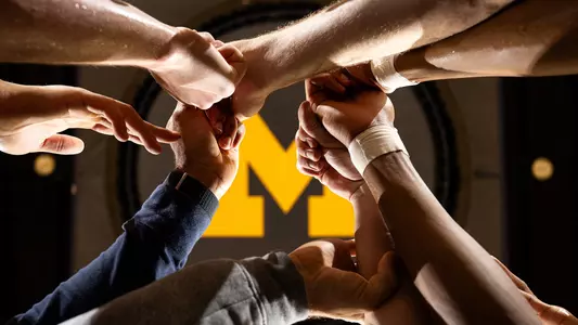 Men's Basketball Team Huddle