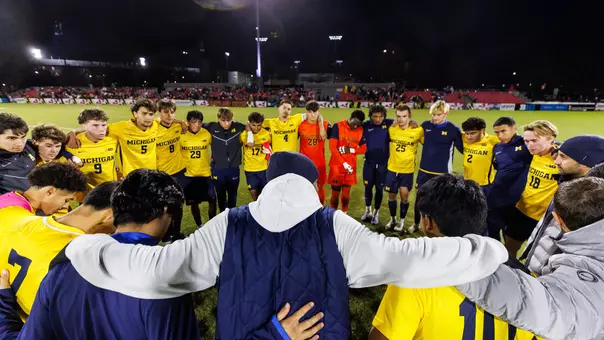 Men's soccer team huddle