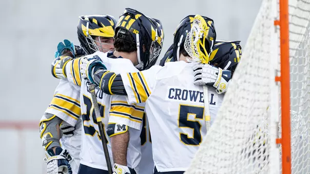 Men's lacrosse team huddle