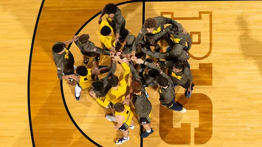 Men's basketball team huddle
