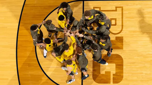 Men's basketball team huddle