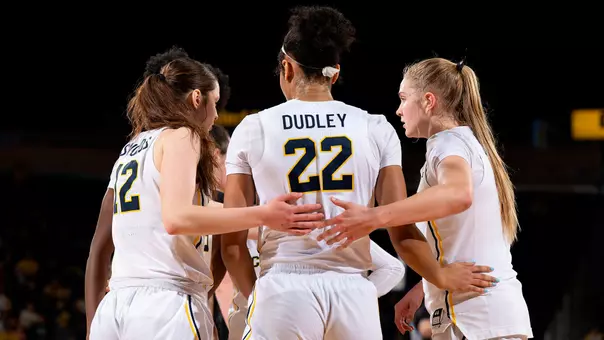 Women's Basketball Group Huddle
