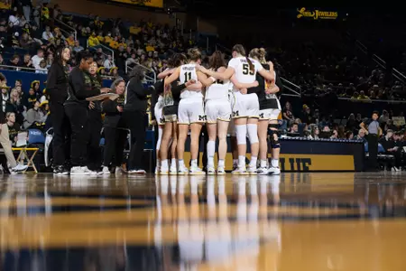 Women's basketball team huddle