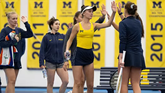 Michigan Women's Tennis high fives