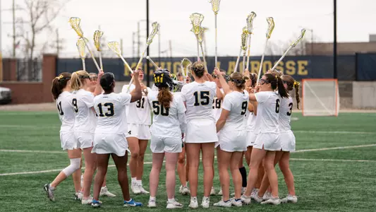 Women's Lacrosse team huddle