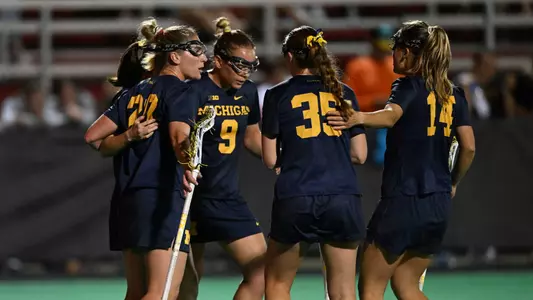 Michigan Women's Lacrosse huddle - Big Ten Championships
