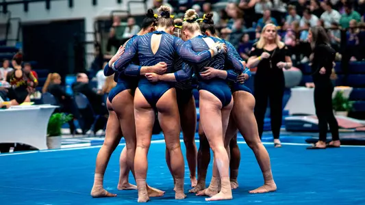 Women's Gymnastics Huddle at Regionals