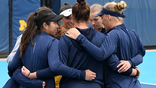 Women's tennis team huddle