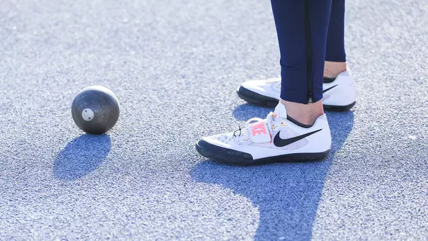 Track and Field Shot Put and Shoes
