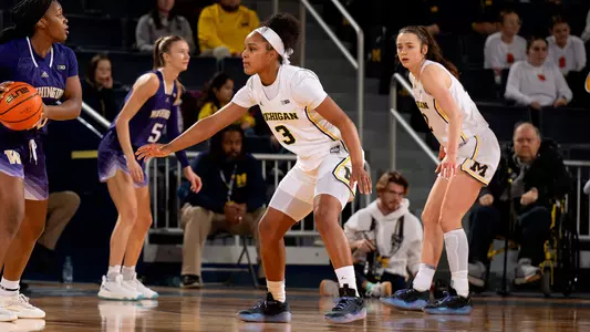 Mila Holloway, center, and Syla Swords, right