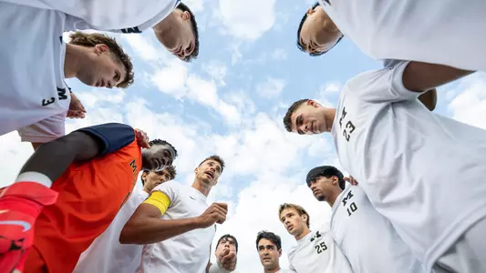 Men's soccer team huddle