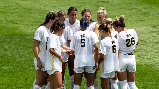 Women's soccer team huddle