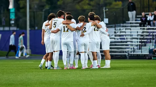 Men's Soccer Team Huddle (Sundodger Creative/Washington Athletics)
