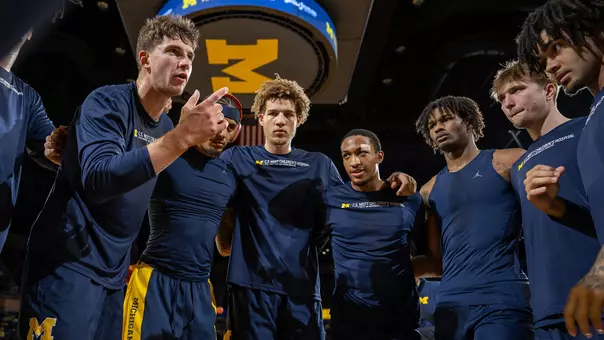 Men's basketball team huddle pregame