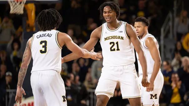 Elliot Cadeau, left, and Morez Johnson Jr.