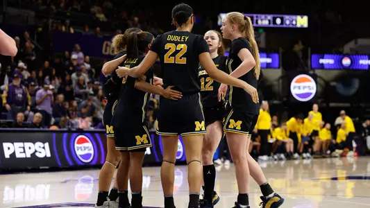 Women's basketball team huddle away