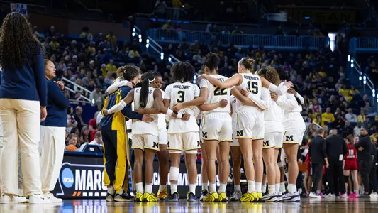 Women's basketball team huddle