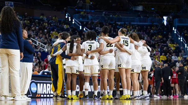 Women's basketball team huddle