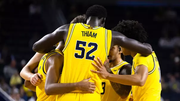 Men's basketball team huddle