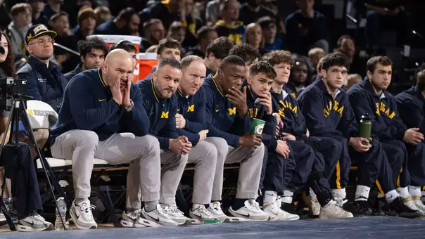 Sean Bormet with Assistant Coaches on Bench