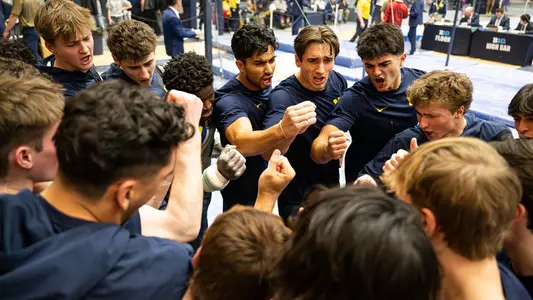 Men's gymnastics team huddle