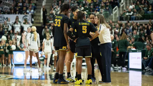 Women's basketball team huddle at Michigan State